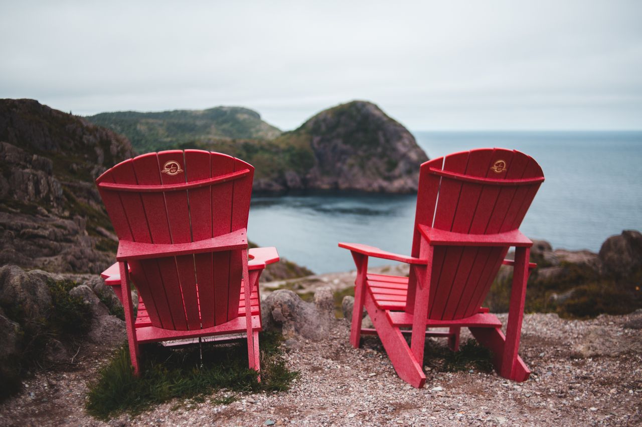 Two chairs at a table with space between them, representing distance in a relationship