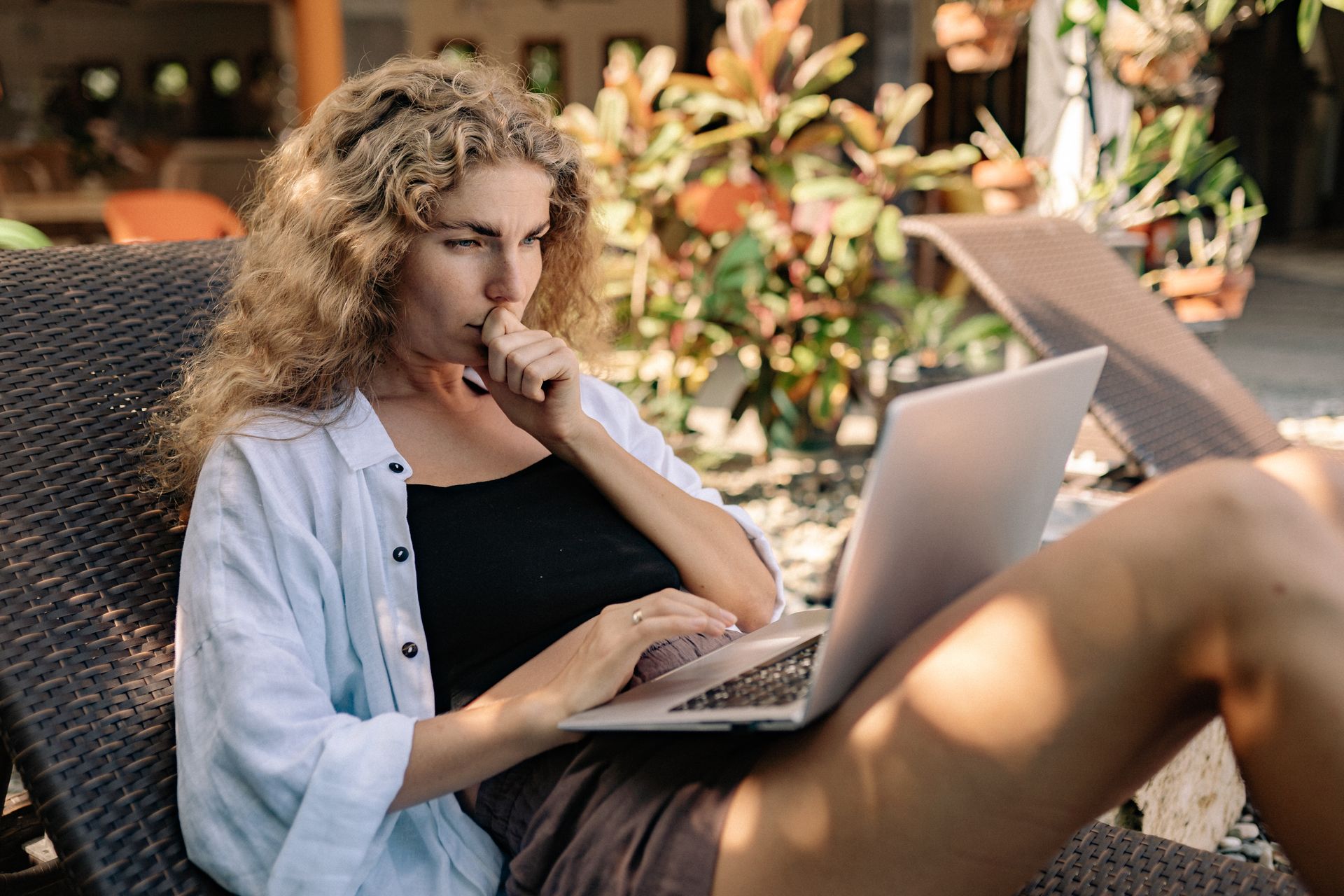 High achiever unable to fully relax during downtime, with laptop